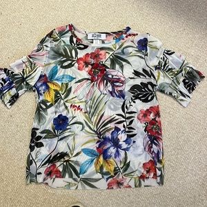Fun shirt that pairs well with black pants jeans and white pants